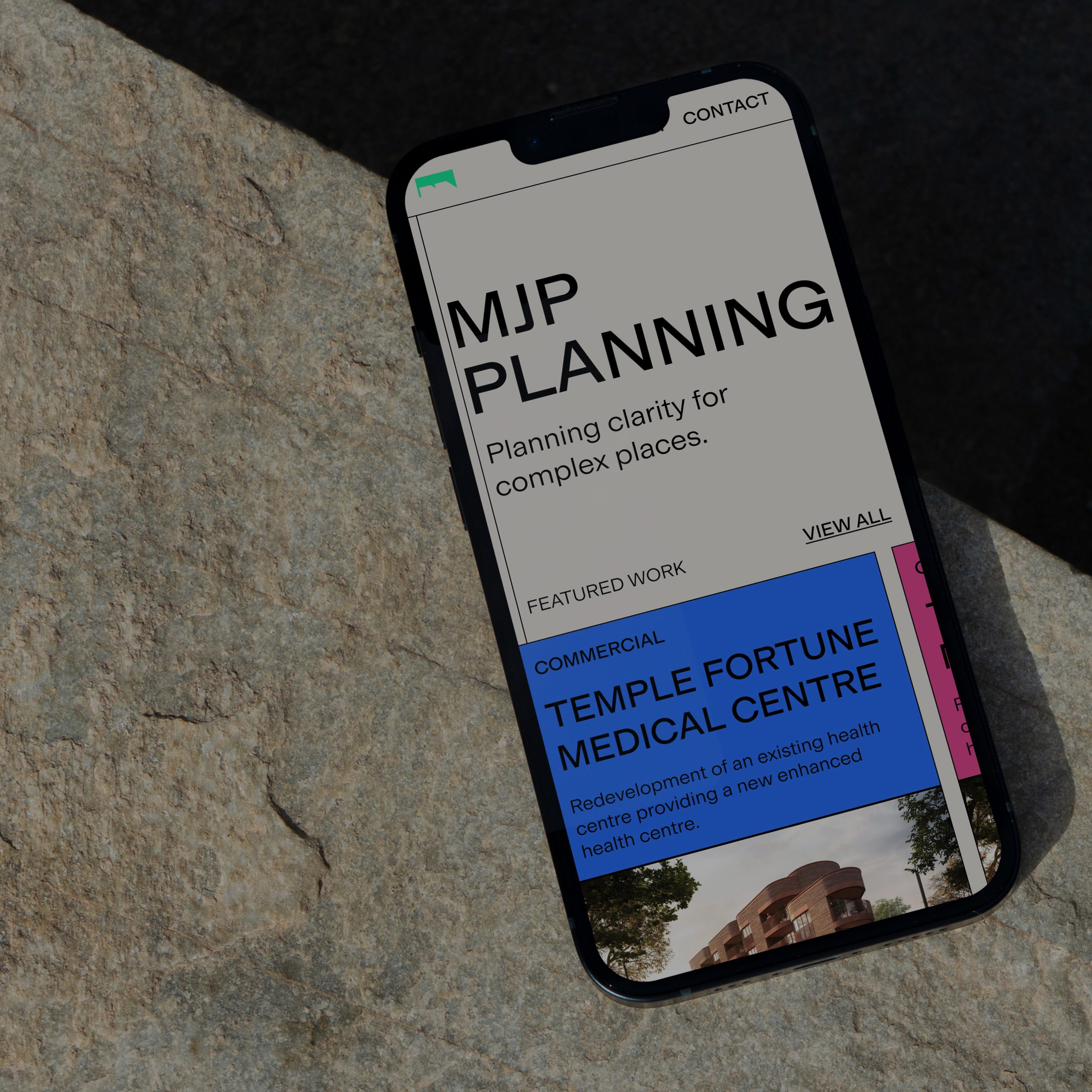 A mobile phone on the homepage of the MJP website