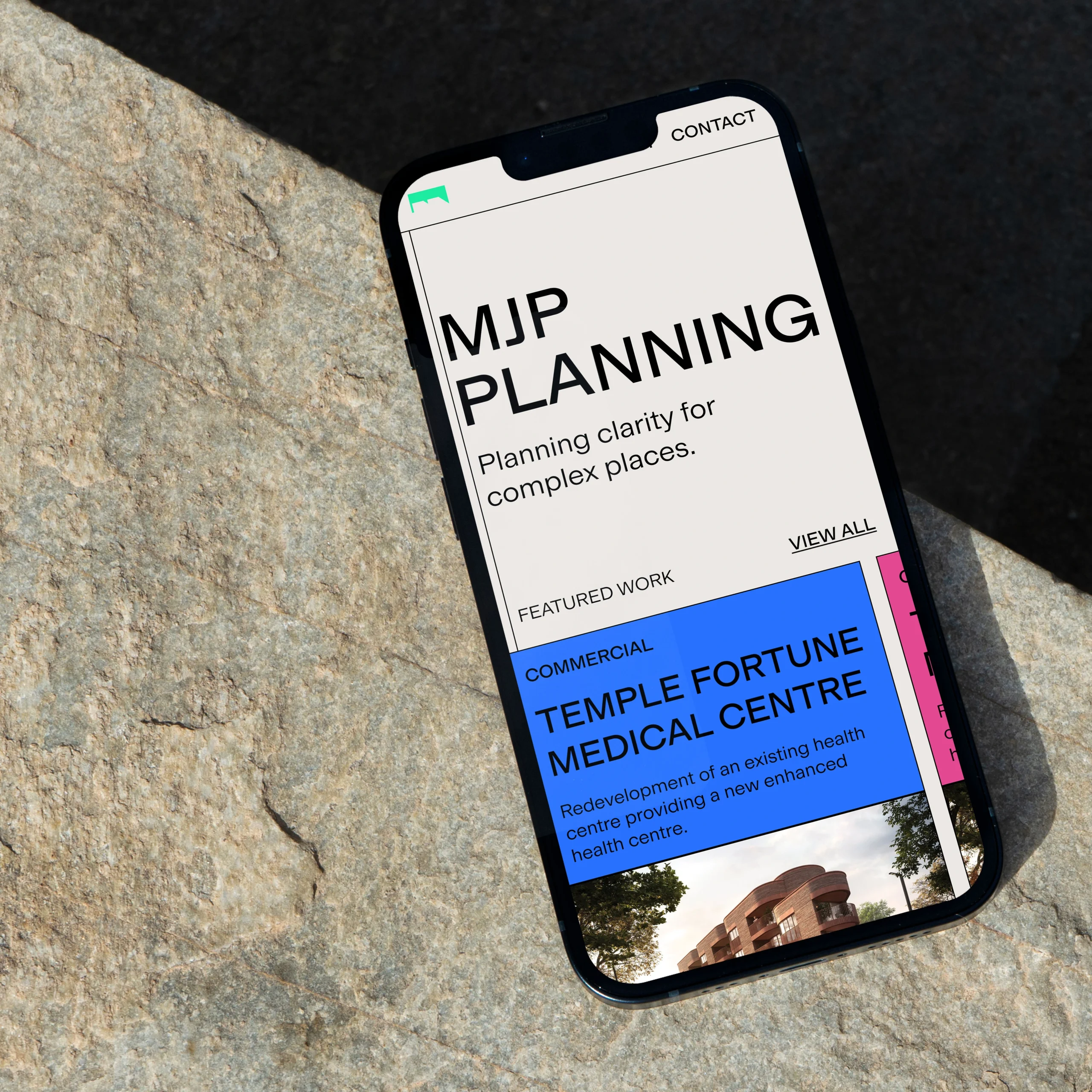 A mobile mockup with the hero section of the MJP website Homepage