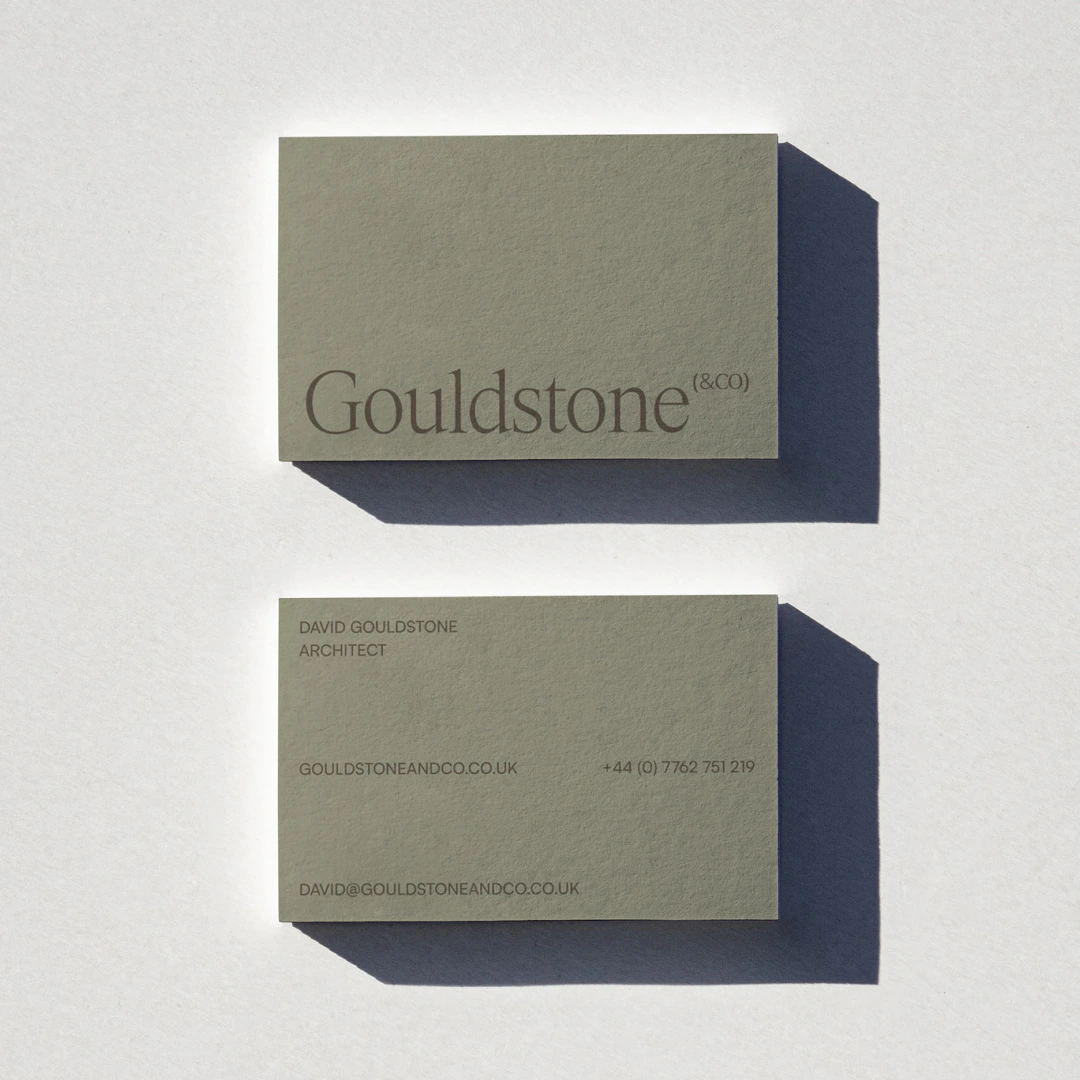 Gouldstone business card designs with the logo across the front and details of David across the back on a soft stone colour