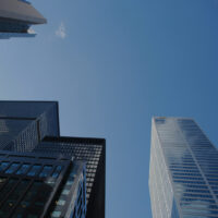 Skyscrapers towering above with a blue sky